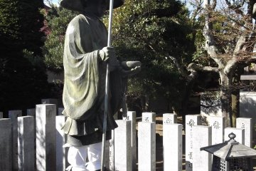 This pilgrim is waiting near the main hall