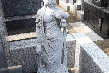 Another Buddhist statue in the graveyard