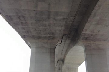 Looking up at the bridge from Maiko Station
