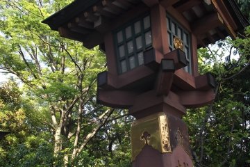 A wooden lantern by the steps up to the halls