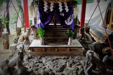 Fox guardians around the small shrine