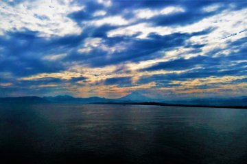 The breathtaking Mt. Fuji can be seen peeking through the clouds even on a gloomy day.