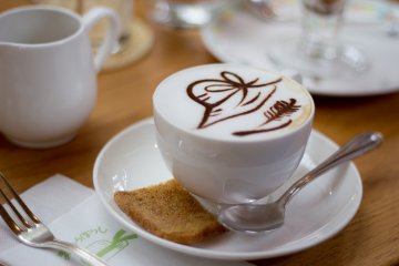 Coffee comes with Straw Hat Cafe latte art