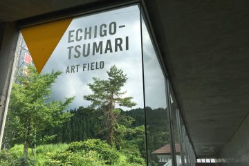 Right at Matsudai station's exit are signs for Echio-Tsumari
