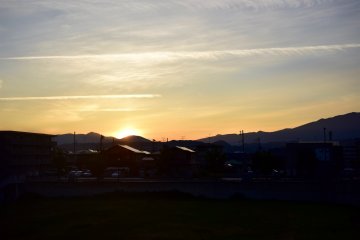 Ducking behind the distant mountains