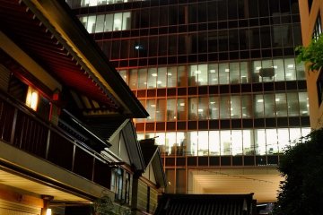 The shrine's lights compete with office towers