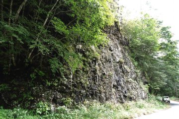 The car in the photo can give you a sense of how huge the rock is