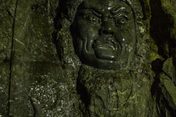 A large relief at the base of the waterfall