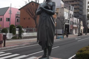 Covering herself near the town hall