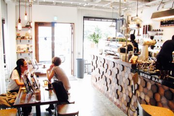 Guests enjoy an iced coffee in the spacious interior