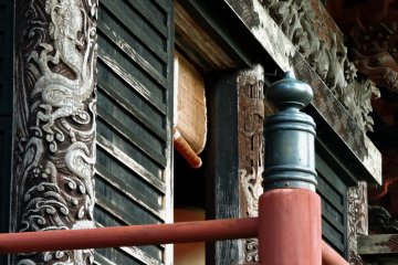 Dragons decorate the pillars of his hall
