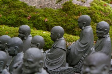 500 statues of priests are waiting for you, and every single one has a unique face expressions