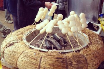 Grilled mochi on a stick.