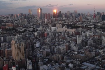 Looking east, the sun reflecting off a building