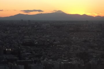 The sun setting somewhere behind Mount Fuji