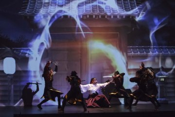 Dancers perform alongside film