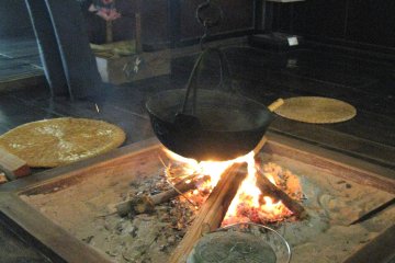 The museum workers keep fire in the houses