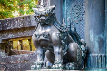 A scary looking creature guards these gates
