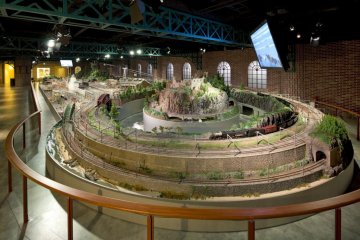 Model trains move along the tracks