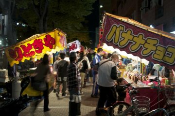 Festival time means various meats and chocolate covered bananas on sticks.