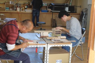 Creating their own phone case out of wood