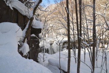 Oirase Valley: small frozen waterfall in the background
