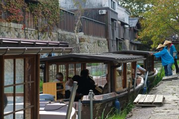 Traditional wooden boats line the canal
