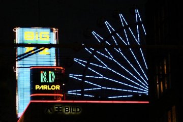 Noria Ferris Wheel and Neon Skyscrapers light up the skyline in Susukino, Sapporo downtown's largest entertainment district