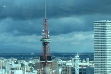 The storms may be brewing from Siberia but Sapporo Tower stands tall above the skyline at Suskino the entertainment center of Sapporo