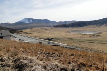 You can see the steaming Nakadake Crater in the distance