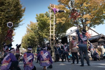 Three ladders were held in place down the street
