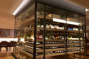 A modern-looking wine cellar in the middle of the restaurant