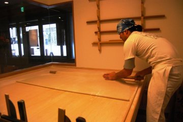 Folding up the dough to get a square shape