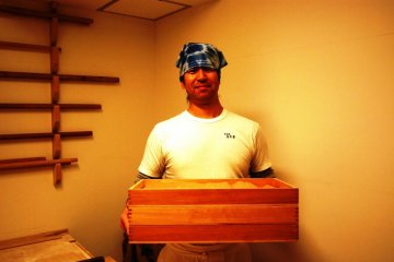 The chef proudly presents his freshly-made soba