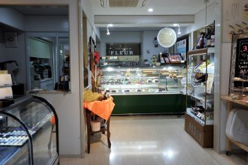 Customers can see desserts being made behind the glass in the retail shop.
