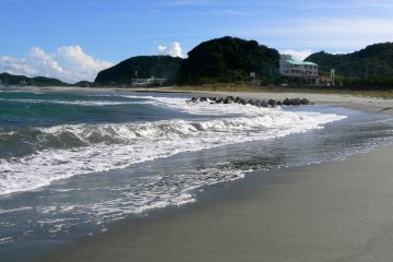 The beach curves at one end