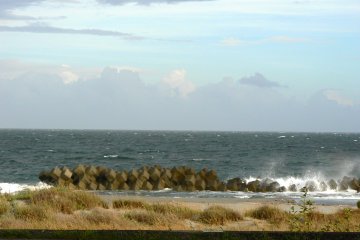 Small waves breaking against the sea wall