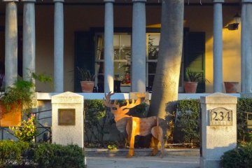 Wooden reindeer near the gate of Yamate 234