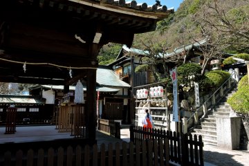Shrine attendant hurrying away after the wedding was over