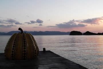Dusk with one of Yayoi Kusama's pumpkins