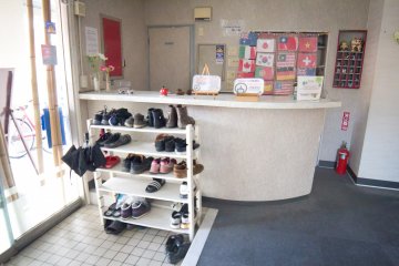 The entrance where you leave your shoes and change into slippers 