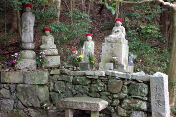 Buddhist statues on the side of the path