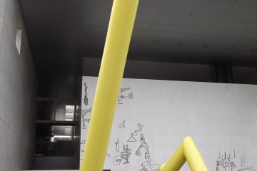 A sculpture and mural at MIMOCA