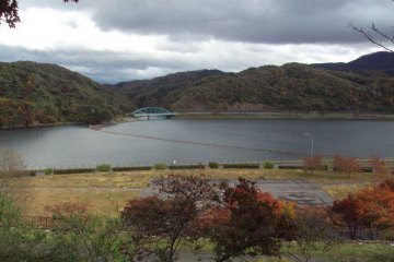 Behind the village is a picturesque view of the river.