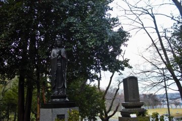A large graveyard is situated along the hillside to the east of the monastery