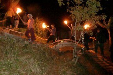 A procession of fire during a festival