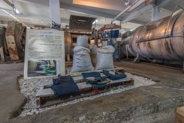 A display inside the jeans museum. The machines on the right are for washing the jeans.