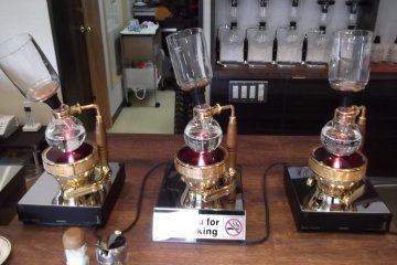 <p>Hubble, bubble, toil and trouble: Coffee siphons on the counter</p>