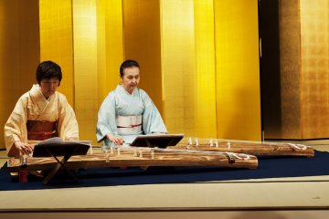 Two women playing the Koto zither