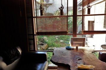 Table with a view of a small inner garden